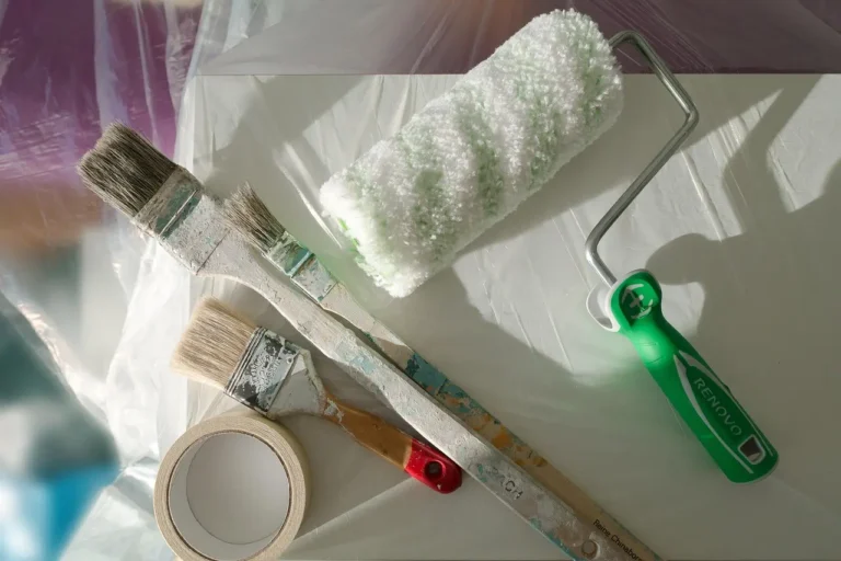 Shoppers comparing paint tins and decorating supplies in an Asda-style supermarket aisle