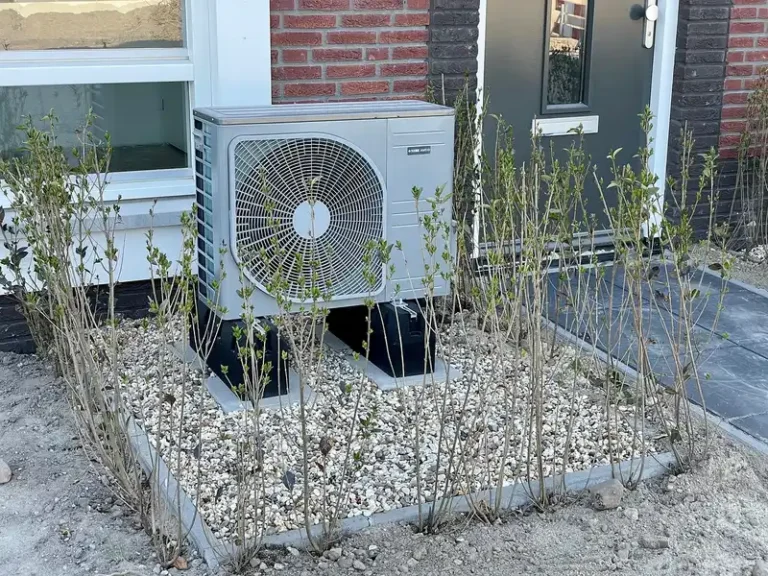 Homeowner comparing a heat pump and a furnace in a bright utility area