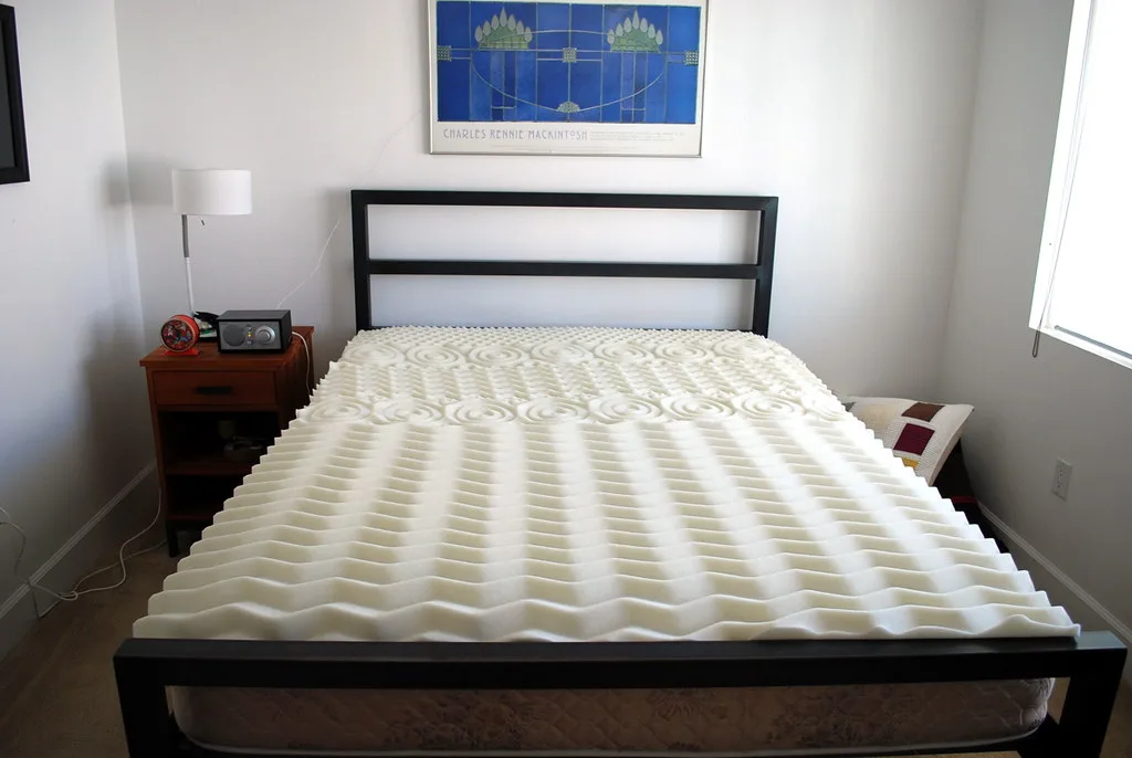 Couple resting on a memory foam mattress in natural morning light