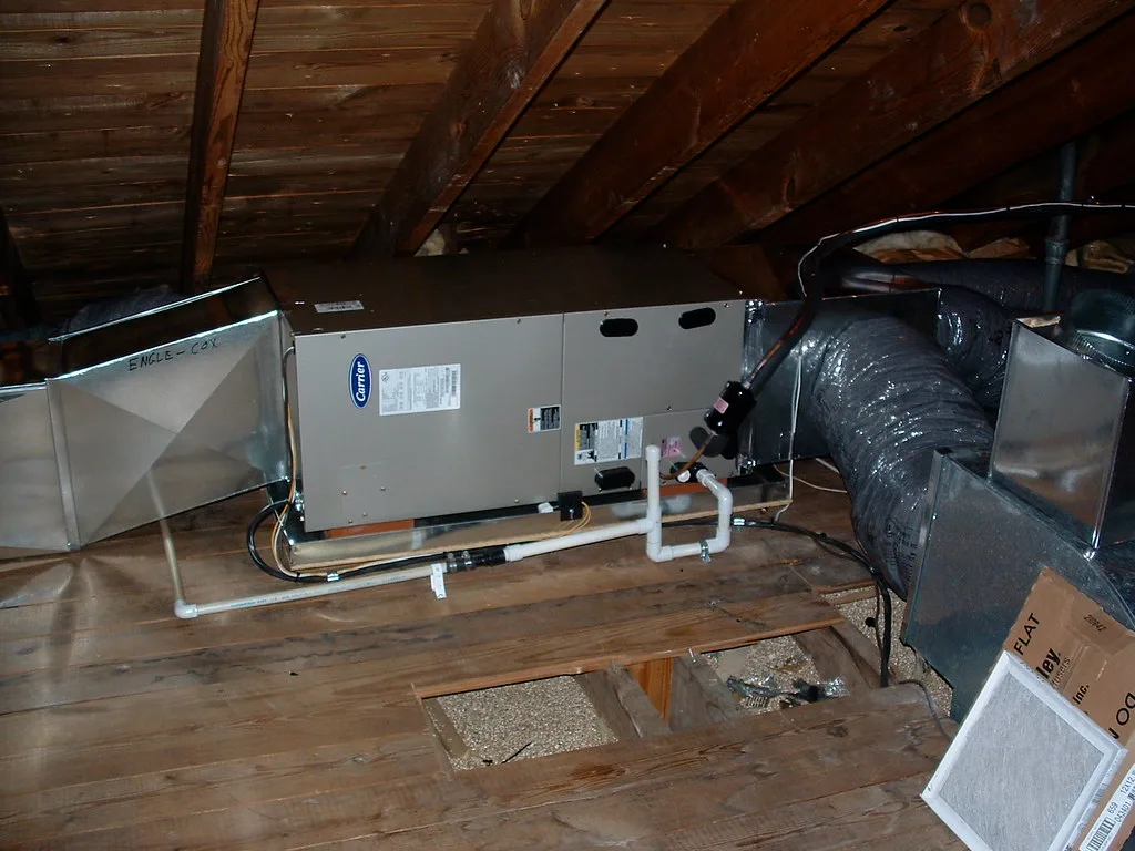 Psychrometer and hygrometer being used near a supply vent to measure moisture