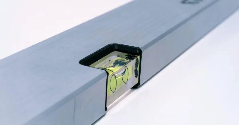 Close up of a torpedo level bubble vial used to check accuracy