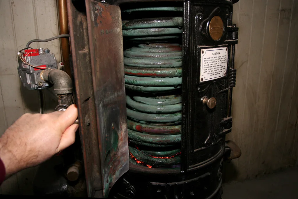 Hand marking overlapping fixtures on a water heater size calculator checklist